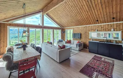 a living room with a couch and a table at Awesome Home In Norheimsund With Wifi in Norheimsund