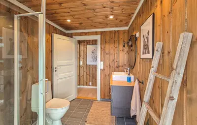 a bathroom with a toilet and a sink at Awesome Home In Norheimsund With Wifi in Norheimsund