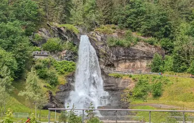 a waterfall on the side of a mountain at Awesome Home In Norheimsund With Wifi in Norheimsund