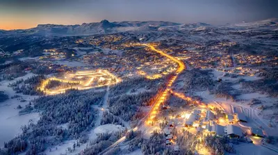 an aerial view of a city in the snow at night at Fjellparken 351 in Beitostøl