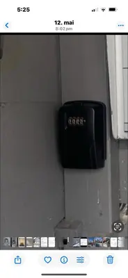 a screenshot of a bathroom with a clock on the wall at Sentralt leilighet in Ålesund