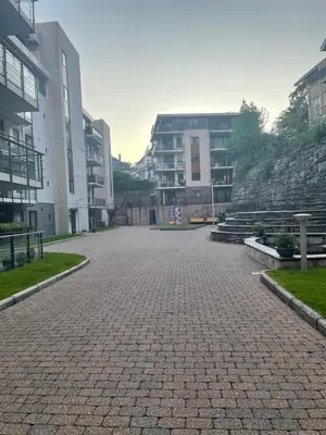 a cobblestone street in front of some buildings at Flott leilighet in Bergen