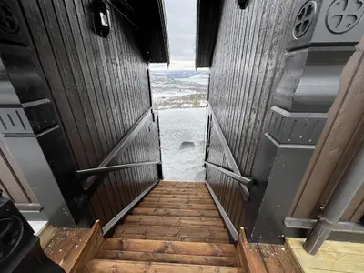a stairway in an airplane with a view of the water at Cozy Apartment With Stunning Mountain Views in Beitostøl