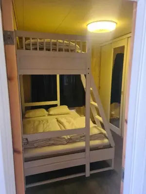 a couple of bunk beds in a room at Koselig Sentrumsleilighet i 2 etg in Nes i Ådal
