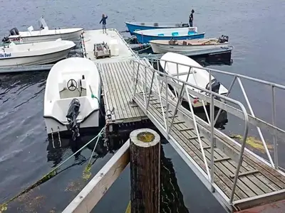 a group of boats docked at a dock at 15 person holiday home in Flatanger-By Traum in Straum