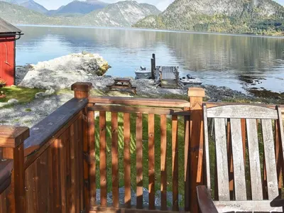 a wooden deck with a view of a lake at 2 person holiday home in Måndalen-By Traum in Sæbø