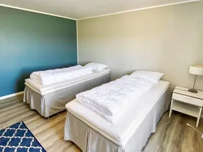 two beds in a small room with at 10 person holiday home in VEVANG-By Traum in Vevang