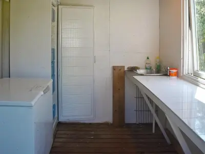 a small kitchen with a sink and a shower at 10 person holiday home in VEVANG-By Traum in Vevang