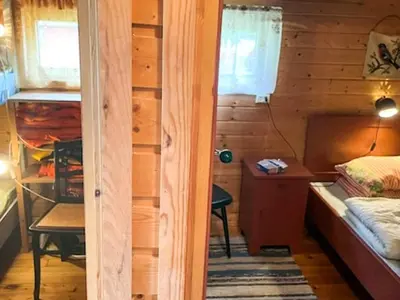 a room with a bed and a desk in a cabin at 4 person holiday home in Eresfjord-By Traum in Øverås