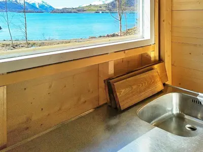 a kitchen with a sink in front of a window at 4 person holiday home in Øydegard-By Traum in Torvikbukt
