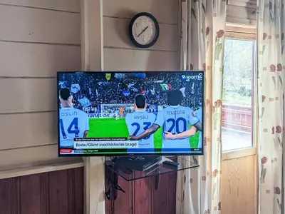 a flat screen tv hanging on a wall at 8 person holiday home in isfjorden-By Traum in Torvik