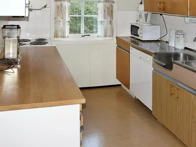 a kitchen with a sink and a counter top at 4 person holiday home in Lauvstad-By Traum in Lauvstad