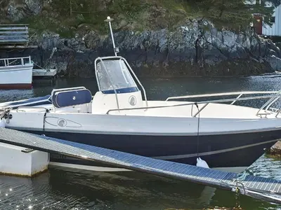 a small boat is docked in the water at 11 person holiday home in VEVANG-By Traum in Vevang