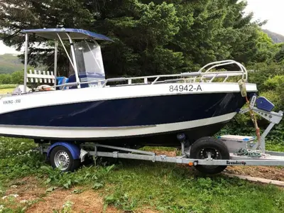 a blue and white boat is on a trailer at 11 person holiday home in VEVANG-By Traum in Vevang