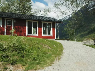 a small house on a hill with a gravel road at 4 person holiday home in olden-By Traum in Olden