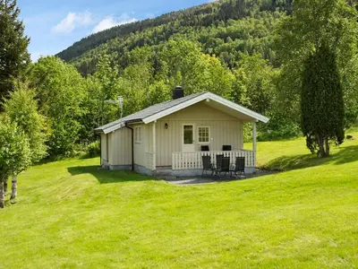 a small house in the middle of a field at 4 person holiday home in Utvik-By Traum in Reed