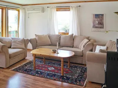 a living room with a couch and a coffee table at 10 person holiday home in HOSTELAND-By Traum in Hosteland