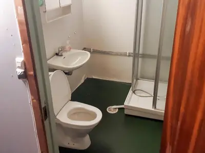 a small bathroom with a toilet and a sink at 8 person holiday home in Åfarnes-By Traum in Årset