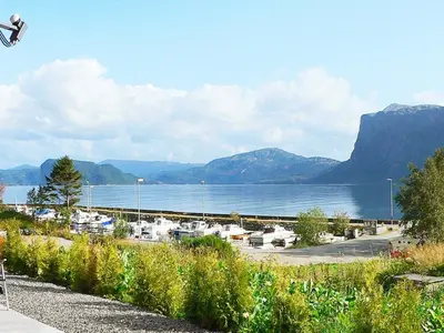 a person doing a trick on a skateboard near a body of water at 6 person holiday home in Sørbøvåg-By Traum in Sørbø