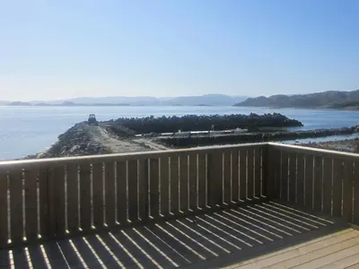 a view of the ocean from the deck of a house at 6 person holiday home in Storfosna-By Traum in Sletta