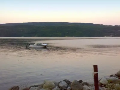 a small boat in the middle of a lake at 10 person holiday home in Follafoss-By Traum in Vølset