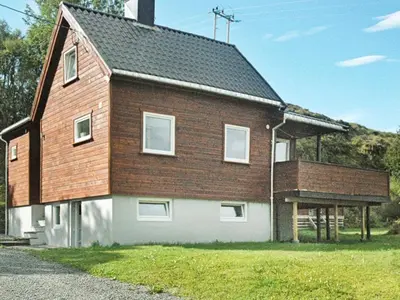 a large house with a gambrel roof at 5 person holiday home in VEVANG-By Traum in Vevang