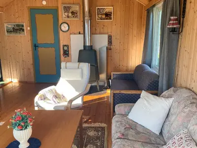 a living room with a couch and a stove at 3 person holiday home in Frei-By Traum in Frei