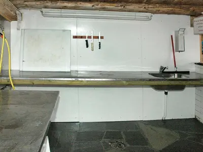 a kitchen with white cabinets and a sink at 4 person holiday home in Surna in Glerem