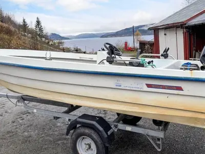 a boat on a trailer in front of a lake at 4 person holiday home in Surna in Glerem