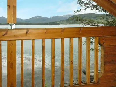 a view of the water from a cabin balcony at 5 person holiday home in VÅGLAND in Bårdset
