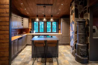 a kitchen with a island in the middle of a room at Trysilfjellet Nord 170 in Trysil