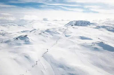 a snow covered mountain range with snow covered mountains at Modern cabin, great view, sunny, 2BA, 4BR in Hemsedal