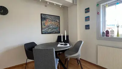 a dining room with a table and chairs at Rustic Apartment in Bakklandet in Trondheim