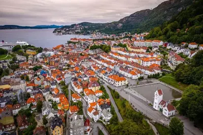an aerial view of a town with orange roofs at Leilighet i Bergens vakreste gate - Nydelig utsikt over innseilingen til Bergen! in Bergen