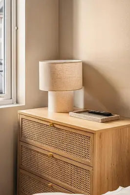 a table with a lamp on top of it at Dinbnb Apartments I Explore Bergen! I 650m To Bryggen I Easy Check-in in Bergen