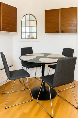 a table and four chairs in a room at Hus med panoramutsikt i Bud in Bud