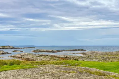 a view of the ocean with rocks and the water at Hus med panoramutsikt i Bud in Bud