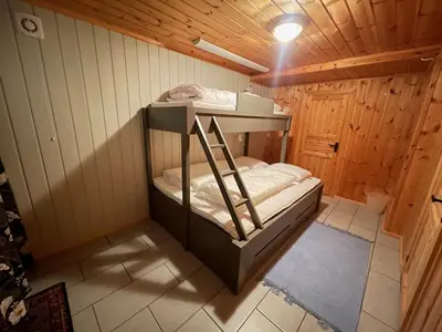 a small room with a bunk bed in a cabin at Perfect Couple's Hideaway In Nature! in Beitostøl