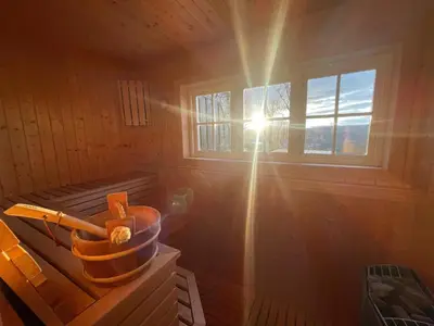 a sun shining through a window in a sauna at Perfect Couple's Hideaway In Nature! in Beitostøl