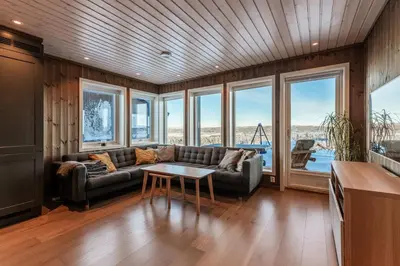 a living room with a couch and a table at Leilighet på Bualie, Golsfjellet in Gol