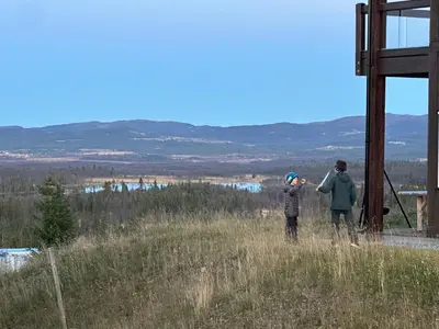 a couple of people standing on top of a hill at Leilighet på Bualie, Golsfjellet in Gol
