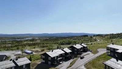 an aerial view of a village with houses and a road at Leilighet på Bualie, Golsfjellet in Gol