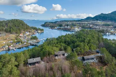 an aerial view of a town and a river at Gunnarhytta, Valevåg in Valevåg