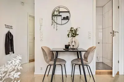 a dining room with a table and chairs at Charming apartment in Sandviken in Bergen
