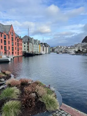 a view of a river with buildings and houses at Charming Modern Apartment Close to Moa & Ålesund in Ålesund