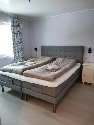 a bedroom with two beds in a room at Fjellhagen - Geirangerfjord view in Hellesylt