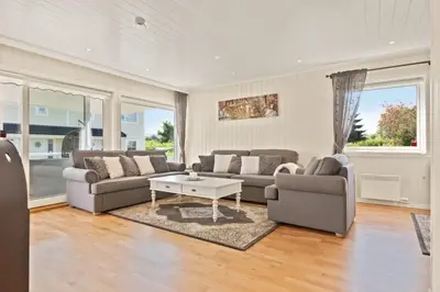a living room with two couches and a coffee table at Luksuriøs enebolig ved Granåsen til Ski-VM 2025 in Trondheim