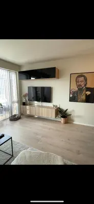 a living room with a large flat screen tv at Rekkehus til SKI-VM in Lund