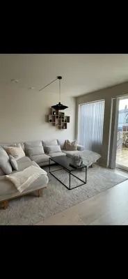 a living room with two couches and a table at Rekkehus til SKI-VM in Lund