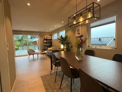 a dining room with a large table and chairs at House close to World cup Trondheim 2025 in Trondheim